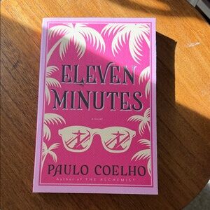 Paulo Coelho Paperback with Pink Cover Accents